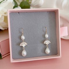 * DETAILS * -  Natural Freshwater Teardrop Baroque Pearls - 18K gold plated on brass Fan Shape Charms size 14mm - Gold Plated earring hooks   🎁 These earrings come in a special designer pouch enclosed in a cardboard box. A designer pull drawer pink gift box is available when the gift wrapping option is chosen. 👉🏻For more earrings, see https://www.etsy.com/shop/JinnysJewelryBySeJin 🌟matching necklace. https://www.etsy.com/JinnysJewelryBySeJin/listing/1177137497/14k-gold-filled-lariat-necklace Gold Plated Round Clip-on Earrings For Wedding, Dainty Gold Bridal Earrings With Ear Wire, Gold Plated Drop Clip-on Earrings For Wedding, Gold Plated Clip-on Drop Earrings For Wedding, Gold Teardrop Clip-on Earrings For Wedding, Wedding Pearl Earrings With 14k Gold Filled Ear Wire, White 14k Gold Filled Bridal Earrings For Wedding, Elegant 14k Gold-filled Bridal Earrings, Elegant 14k Gold Filled Bridal Earrings