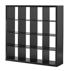 a black bookcase with squares on the front and bottom shelves, all in different sizes