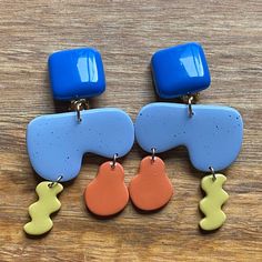 Loud and large clip on earrings. Multicoloured plastic and polymer shapes. Very abstract. Lightweight. Clip on closures.  Earrings are not intended to be worn while sleeping bathing or swimming. Not recommended for children under three.  See more: https://www.etsy.com/ca/shop/CleverLittleEars CANADIAN PRICES INCLUDE GST/HST WHERE APPLICABLE. ETSY WILL CALCULATE ANY PST OWING AT CHECKOUT. While the cost of shipping makes returns or exchanges impractical, please do contact me with any concerns about your order and we will work together to address them.  By law, European buyers have 14 days from receipt to request a return. Return shipping costs will not be covered by CleverLittleEars. Modern Blue Geometric Earrings, Earrings Ceramic, Earrings Geometric, Clay Design, Handmade Modern, Modern Earrings, Clip On, Etsy Finds, Clip On Earrings