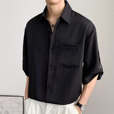 This Button Down Shirt Japanese Style Short Sleeve is perfect, just perfect. Made from a combination of cotton and polyester, the shirt is comfortable and breathable. The chic style and turn-down collar make it a fashionable choice. The solid pattern and three quarter sleeve length make it suitable for summer. This shirt is perfect for any occasion. Whether you're going out for a casual lunch or just running errands, this shirt will keep you looking stylish and feeling comfortable. It's a great Trendy Solid Color Short Sleeve Shirt, Casual Button-up Short Sleeve Shirt In Solid Color, Trendy Black Top With Casual Collar, Modern Black Summer Shirt, Black Shirt For Summer, Black Half-sleeve Summer Shirt, Black Half Sleeve Summer Shirt, Business Casual Solid Color Button-up Shirt, Casual Shirt With Lapel Collar And Buttons