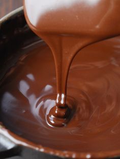 melted chocolate being poured into a saucepan