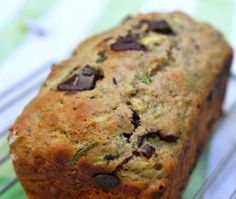 a loaf of chocolate chip zucchini bread on a cooling rack