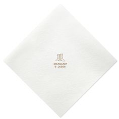 a white napkin with a gold logo on it