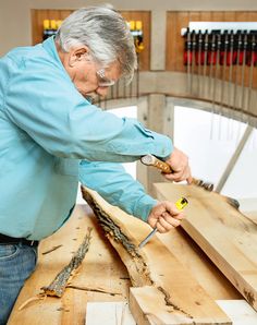 an older man is working on some wood