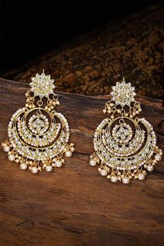 I Jewels Women's/Girls 18K Gold Plated Metal Alloy Traditional Handcrafted Beaded Big Chandbali Earrings (E7077W, White) This Earring set is crafted in gold plated finish with stunning antique finish - these earrings are really special .The Earrings feature Kundan-studded.Be stylish and smart with these Golden Earring. Perfectly crafted. Wear it with a suit or a saree, and lehenga for an ethnic yet classy look. This earring set is a great option and a perfect pick for your wedding functions. Be Sabyasachi Earrings, Jewellery Shoot, Heavy Earrings, Chandbali Earrings, Traditional Earrings, Kundan Earrings, Boutique Collection, Indian Earrings, Fancy Jewellery