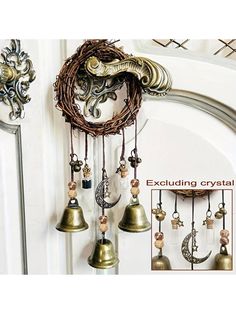 an assortment of bells hanging from the side of a door