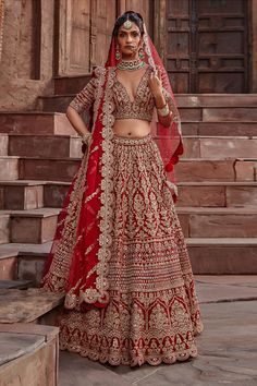 Blood red attached can-can lehenga with gota, sequin, dabka and crystal work. Comes with padded blouse and dupatta.
Component: 3
Pattern: Embroidered
Type Of Work: Gota, Sequin, Dabka and Crystals
Neckline: V neck
Sleeve Type: Half
Fabric: Velvet
Color: Red
Other Details: 
Scalloped hems
Low back with tie up and tassels
Dupatta with scallop border
Note: The veil worn by the model is not for sale
Note: The veil will be available on request, please contact our customer service for more details
Occ Red Chandbali Lehenga For Eid, Red Kundan Lehenga With Dupatta, Red Kundan Lehenga For Eid, Red Semi-stitched Kundan Sets, Red Semi-stitched Anarkali Lehenga, Red Kundan Choli For Eid, Semi-stitched Red Kundan Choli, Red Semi-stitched Kundan Choli, Semi-stitched Red Lehenga With Zari Work