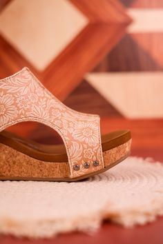 Maximize your potential in the nude colored Isabella Tooled Wedge Sandals! With a velcro closure for complete adjustability, enjoy all-day comfort and unstoppable confidence with every step. Fit: True to Size. If you wear a 1/2 size or have a wide width foot, size up a half size.Heel: 3" Brand: Very G Overall Skirt Denim, Wedge Heel Sneakers, Nude Wedges, Summer Denim, Sneaker Heels, Active Wear Leggings, Denim Top, Denim Shop, Wedge Heels