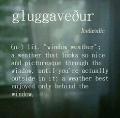 a window with the words gluggaveour written on it and an image of trees in the background