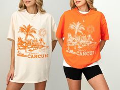 two women standing next to each other wearing orange and white t - shirts with the words cancun printed on them