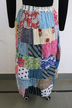 Adjustable Waist Size: One Size; Fits up to US Size Large Waist: Fits up to Approx. 36 inches Length: Approx. 39 inches HIPS: Fits up to Approx. 38 inches This long patchwork skirt has an elasticated waist for comfort and can easily be pulled on over the head or up from the ankles as desired. Always one of a kind patchwork boho style long floaty skirt for festivals and parties Lightweight and comfy made of cotton colorful materials SINCE THIS SKIRT IS MADE OF DIFFERENT PATCHES OF SARI, THE ONE YOU WILL Blue Patchwork Relaxed Fit Skirt, Multicolor Patchwork Tiered Skirt Bottoms, Blue Patchwork Long Skirt, Blue Patchwork Maxi Skirt For Summer, Multicolor Patchwork Flowy Skirt, Blue Long Patchwork Skirt, Cotton Patchwork Flowy Maxi Skirt, Relaxed Tiered Patchwork Skirt, Cotton Patchwork Maxi Skirt