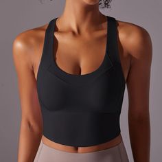 Introducing the Electra Active Top - the perfect addition to your workout wardrobe. With a sleek cross-back straps for added support and a mid length design, this top provides both style and function. Available in a variety of vibrant colors to elevate your workout wardrobe Product Details: Nylon Crossback Straps Mid Length Padded cups Imported Compression Tops With Built-in Padding For Pilates, Solid Activewear With Built-in Padding And Wide Straps, Versatile Activewear With Built-in Bra And Tank Straps, Gym Tank Top With Built-in Padding And Wide Straps, Versatile Activewear With Built-in Bra And Cross Back, Scoop Neck Gym Tank Top With Built-in Padding, High Stretch Tops With Built-in Padding For Gym, Scoop Neck Tank Top With Built-in Padding For Gym, Versatile Sports Top With Built-in Padding