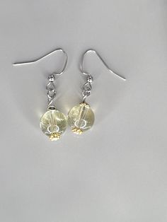 "Simple pair of dangle earrings 1.5\" drop approx. 10 mm lemon quartz Stainless steel ear wires and findings" Yellow Dangle Earrings With Ear Wire, Clear Round Earrings With Ear Wire, Nickel-free Clear Drop Earrings, Nickel Free Clear Drop Earrings, Yellow Dangle Earrings For Jewelry Making, Yellow Dangle Earrings With Lever Back, Gemstone Drop Earrings, Stone Dangle Earrings, Lemon Quartz