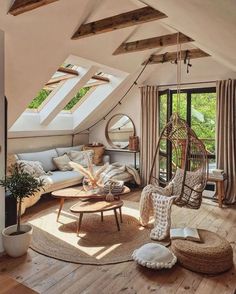 a living room filled with lots of furniture next to an open roof window on top of a wooden floor