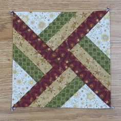 a close up of a piece of fabric on a wooden table with wood flooring