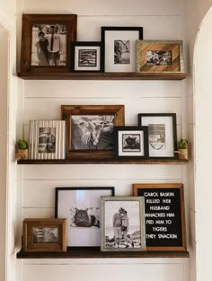 three wooden shelves with pictures and framed photos on them, along with some other items