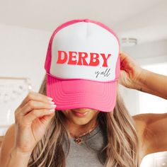 🏇 Kentucky Derby 150 is almost here, what better hat to get and wear to the track than this Derby y'all retro trucker cap.  Four fun colors are available (including, Pink, Black, Red and Blue, and Green) and they make great group hats. If you have a group going to the infield at the track, have everyone wear this hat and always know where each other is! This vintage hat is fun to wear all year round when you have the Derby spirit. Perfect for the horse lover, best friend, hostess, and of course Group Hats, Retro Hat, Derby Horse, Ky Derby, Derby Cars, Retro Hats, Vintage Hat, Gifts For Horse Lovers, Kentucky Derby