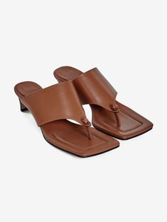 Editor's NoteNeute designs shoes with the natural luxury of leather.- Dressy yet classic sandals- Stable fit with wide strap on the instep- Cushioning insole gives comfortable fit- Square shaped toe Measurements (in.)- Size: KR 220MM - KR 260MM (35 - 39)- Heel Height: 1.57 in. Composition & Care- Upper: Cow Leather, Lining: Pig Skin, Sole: Suede Sole- All products are hand-made, so sewing and finishing may not be uniform, and double stitching, fine pen marks, and removable bond mar Classic Brown T-strap Sandals For Summer, Brown T-strap Sandals With Heel Strap And Open Toe, Brown Square Toe Heels With Deep Heel Cup, Brown Sandals With Heel Strap And Square Toe, Brown Open Toe T-strap Sandals With Removable Insole, Brown Square Toe Sandals With Heel Strap, Calf Leather Heels With Single Toe Strap, Leather Mules With Sculpted Heel And Single Toe Strap, Classic Almond Toe Mules With Heel Loop