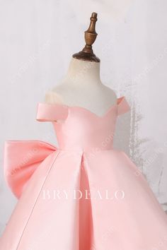 For a princess look with a dash of delicacy, this adorable baby pink satin Off-shoulder Big Bow Designer Structured High Low Flower Girl Dress features off-the-shoulder bodice with lace-up back and a pretty removable big bow. The puffy high-low skirt provides more structure and fashion. shown color baby pink lining fully lined length high-low closure lace-up Cute Pink Off-shoulder Dress, Pink Bridesmaid Dress With Bow, Pink Prom Dress With Bow Straps, Pink Wedding Dresses With Bow Straps, Pink Fitted Satin Princess Dress, Pink Prom Dress With Satin Bow, Elegant Pink Satin Princess Dress, Pink Satin Dress With Satin Bow, Satin Princess Dress With Bow For Pageants