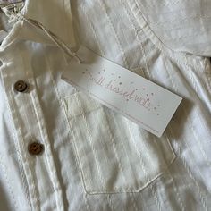 Well Dressed Wolf Short Sleeve Button Down Shirt Boys Size 4t Cream Colored With Beautiful Dainty Embroidered Details & Wooden Buttons 100% Cotton New With Tags, Excellent Condition Cute White Collared Dress, Cute White Button-up Shirt, Cute Button-up Shirt With Details, Cute White Button Shirt, Cute Cotton Button-up Dress, Cute Button-up Cotton Dresses, White Cotton Dresses With Placket, Cream Cotton Shirt With Buttons, White Button Tops For Playtime