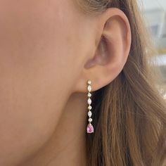 We know you'll love the exquisite Delta Dangle Earrings! These earrings are definitely a statement, as they are collectively adorned with round brilliant cut and marquise shaped diamonds enhanced with a pear shaped pink sapphire stones. These elegant earrings are sure to be showstoppers. This item is sold as a pair. If interested in buying as a single, please contact us. Metal: 18k White Gold / 18k Yellow Gold / 18k Rose Gold 14 Natural Diamonds: Approx. 0.52 ctw per pair 2 Pink Sapphires: Approx. 0.72ctw per pair G/H Color and SI1-2 Clarity Diamonds Measurements: Dangle length Approx. 31.8mm Closure: Post with push back Marquise Diamond Single Earring, Fine Jewelry Diamond Teardrop Linear Earrings, Teardrop Diamond Linear Earrings Fine Jewelry, College Rings, Sapphire Stones, Marquise Shape Diamond, Mens Engagement, Bridal Bands, Tennis Necklace