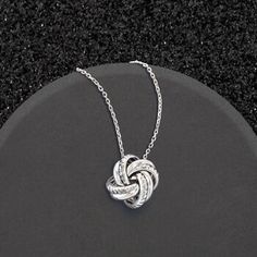 Ross-Simons - Italian Sterling Silver Love Knot Pendant Necklace. 20". A lovely and intricate design: a love knot shines in textured and polished sterling silver in this classic necklace. A very popular and beloved symbol, the love knot is a visual display of the love of two hearts that are forever entwined. Made in Italy. Suspends from a cable chain. Lobster clasp, sterling silver love knot pendant necklace. Luxurious Necklace, Personalized Charm Necklace, Diamond Evil Eye, Silver Monogram, Necklace Stand, Circle Pendant Necklace, Classic Necklace, Knot Earrings, Evil Eye Pendant