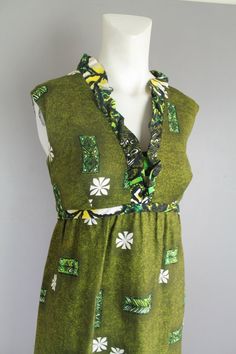 "Pair this cute little hostess dress with some bright tassel earrings and your favorite sandal. It is without holes, stains, or tears. Estimated size 8 (M) 36\" bust 30\" waist 44\" hip 51\" shoulder to hem Purveyor's Note: We have searched far and wide, wrestled bears, braved the cold, traversed mountain ranges, fought pirates, swam with sharks and eaten at many a questionable road side taco stand to provide our customers with one of a kind vintage pieces. Know that whichever piece you choose t 1970s Style Green Summer Dresses, Green Vintage Dress For Vacation, Vintage Summer Holiday Dresses, Green On Green, Taco Stand, Hostess Dresses, Mod Print, Mountain Ranges, Beach Babe