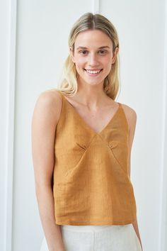 "The unique neckline and feminine design will have everybody's eyes set on you. If you need a little something to elevate your wardrobe and awaken your inner Goddess - VIOLA might be the top for you. FABRIC: 100% softened Lithuanian linen COLOR: Please choose the desired color from the side menu. STYLE: Sleeveless linen crop top with a scoop neckline. If you need another style, length, sleeves length, or color, please contact us. SIZE CHART (body measurements): XS Bust 28- 31\" (72- 80 cm) Waist Long Linen Skirt, White Linen Skirt, Linen Sleeveless Top, V Neck Crop Top, Linen Top Women, Linen Crop Top, Linen Fashion, Linen Tank Top, Linen Tank