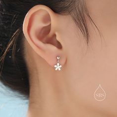 A dainty pair of earrings featuring a cute flower design.  Sold as a pair.  Complete with sterling silver butterfly backs.  Dimensions : 8mm flower. Materials and Care: These are made of sterling silver, they have been partially coated with 18ct gold plating. Only precious metals are used and they are hypoallergenic. Please keep in a sealed plastic bag when not wearing.  Packaging: All our jewellery comes with our branded velvet bag so your item is ready to be gifted.    Production Method: Small Batch lost wax casting.  ------------------------------------------------------------------- ★Free Shipping for UK orders. International orders with a flat postage fee. All our items are ready to ship within 48 hours. Orders arrive within 5 working days for UK orders and international delivery time Delicate Silver Drop Flower Earrings, Dainty Sterling Silver Flower Earrings For Anniversary, Hypoallergenic Sterling Silver Flower Earrings For Wedding, Hypoallergenic White Gold Flower-shaped Jewelry, Dainty Nickel-free Flower Earrings For Anniversary, Dainty Silver Flower Charm Earrings, Delicate Silver Dangle Flower Earrings, Dainty Sterling Silver Flower Earrings, Delicate Silver Flower Earrings