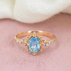 Embrace timeless elegance with our Swiss Blue Topaz Gold Ring, a stunning piece that radiates sophistication and grace. This exquisite ring, reminiscent of vintage style promise rings, captivates with its enchanting Swiss blue topaz gemstone.  Whether as an engagement ring symbolizing eternal love or a promise ring marking a cherished commitment, its beauty is undeniable. Crafted with meticulous attention to detail, this Swiss blue topaz ring is sure to become a treasured heirloom, adding a touc Elegant Light Blue Diamond Ring, Luxury Wedding Blue Topaz Diamond Ring, Elegant Topaz Crystal Promise Ring, Elegant Promise Crystal Topaz Ring, Fine Jewelry Light Blue Topaz Ring With Diamond Accents, Fine Topaz Birthstone Promise Ring, Elegant Aquamarine Birthstone Ring With Accent Stones, Elegant Light Blue Topaz Ring With Accent Stones, Luxury Topaz Wedding Ring