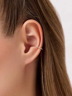 Our coolest ear cuff just got a sparkly new update. Plated in shiny 14k gold, this sleek cuff features a versatile silhouette designed to fit seamlessly into your everyday stack. Finished off with cubic zirconia embellishments, this cuff adds an essential touch of sparkle to everything. Need stacking inspo? We’d recommend pairing this cuff with our Sage earrings for a unique stack. • Plated in 14k gold • Cubic zirconia embellishments• Lightweight ear cuff 14k Gold Ear Cuff, Simple Ear Cuff, Earring Stack, Gold Ear Cuff, Everyday Earrings, Letter Necklace, Silhouette Design, Ear Cuff, Piercings