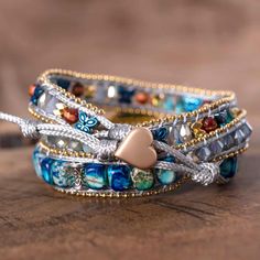 Get inspired by the charming nature with our new Moonbeam opal stone charm multilayered Leather wrap bracelet this Breathtaking wrap bracelet is carefully handmade from natural opal stones added on imperial jasper beads , adding a very unique magic inspired from the charming nature to your boho beautiful style . * Material : opal, butterfly, metal beaded chain, crystals, imperial stones, waxed cord. * Making Technics : handmade braided. * Size : Around 19 inches+3 closures. * Custom Service : Ac Turquoise Multi-strand Wrap Bracelet As Gift, Unique Multicolor Wrap Bracelet For Healing, Handmade Spiritual Multi-strand Wrap Bracelet, Spiritual Handmade Multi-strand Wrap Bracelet, Bohemian Labradorite Bracelet For Gift, Bohemian Labradorite Bracelet Gift, Adjustable Natural Stones Wrap Bracelet, Bohemian Gemstone Beads Jewelry For Friendship, Unique Hand Wrapped Healing Wrap Bracelet