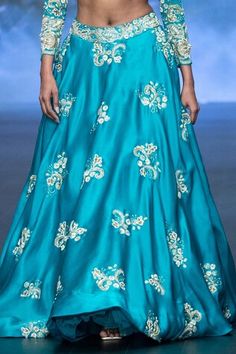 Turquoise blue panelled lehenga featuring zardozi-zari embroidered floral motifs, embellished by beads, sequins, pearls along with attached can can. Comes with embroidered padded crop top in cut-out silhouette. - Aza Fashions Bollywood Style Blue Gown For Festivals, Blue Dress With Zari Work For Reception, Blue Embellished Lehenga For Diwali, Blue Floor-length Traditional Wear For Reception, Blue Gown For Diwali Reception, Blue Gown For Reception During Diwali, Blue Gown For Reception And Diwali, Blue Saree Gown With Intricate Embroidery, Designer Blue Saree-shaped Gown