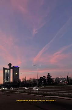 the sky is pink and blue with some clouds