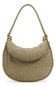 With this soft leather shoulder bag, crafted in the house's iconic intrecciato weave, a removable exterior pouch captures all the things you want close at hand. Top zip closure Shoulder strap Removable exterior zip pouch; interior zip pocket Lined Leather Made in Italy Designer Handbags Beige Pouch Bag With Intrecciato Weave, Modern Crossbody Shoulder Bag With Intrecciato Weave, Beige Pouch Shoulder Bag With Intrecciato Weave, Beige Intrecciato Weave Pouch Shoulder Bag, Modern Intrecciato Weave Crossbody Shoulder Bag, Versatile Leather Shoulder Bag With Intrecciato Weave, Elegant Beige Hobo Bag With Intrecciato Weave, Versatile Intrecciato Satchel Shoulder Bag, Versatile Intrecciato Weave Satchel Shoulder Bag