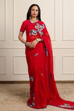 Harshini red saree featuring silk floss embroidered flowers. Comes with an unstitched blouse piece. - Aza Fashions Red Georgette Pre-draped Saree With Pallu, Traditional Red Pre-draped Saree With Resham Embroidery, Red Pre-draped Saree With Dori Work For Reception, Traditional Red Pre-draped Embroidered Saree, Traditional Red Embroidered Pre-draped Saree, Red Pre-draped Saree With Unstitched Blouse For Navratri, Red Semi-stitched Pre-draped Saree With Resham Embroidery, Red Designer Pre-draped Saree, Red Pre-draped Saree With Resham Embroidery For Diwali