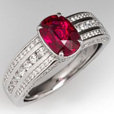 This designer Kat Florence ring is centered with an oval mixed cut ruby in a four-prong setting. The lower gallery is bead set with twenty-eight (28) round brilliant cut diamonds. Each shoulder is channel set with eight (8) round brilliant cut diamonds and bead set with twenty-six (26) round brilliant cut diamonds. The faces are each bead set with eighteen (18) round brilliant cut diamonds. Signed Kat Florence. Article No. KF02578. The ring fits like a size 8 with an inner spring ring to keep it snug. We are not offering resizing on this ring. The ring will come with the original box and certificate. Red Oval Diamond Ring In Platinum, Oval Red Diamond Ring In Platinum, Elegant Gia Certified Ruby Ring, Luxury Ruby Jewelry Channel Set, Luxury Ruby Channel Set Jewelry, Luxury Diamond Ring With Lab-created Ruby Accents, Luxury Channel Set Ruby Jewelry, Luxury Ruby Ring Channel Set For Anniversary, Luxury Oval Diamond Ring With Channel Set