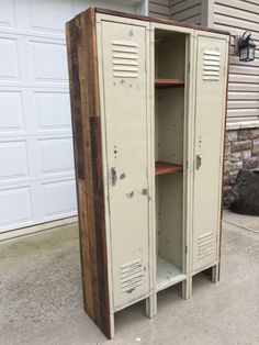 two metal lockers sitting in front of a garage