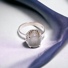 DETAILS "Precious Chysoberyl Cats Eye Ring, Gemstone Ring, White Statement Ring, 925 Sterling Silver Jewelry, Wedding Gift, Ring For Sister" ❥ Gemstone: Chysoberyl Cats Eye ❥ Main Stone Size : 11X9 ❥ Color : White ❥ Length :  ❥ Metal : 925 Sterling Silver ❥ Weight : 3.7 gm ( Approximate ) Comes in a FREE GIFT BOX Other Chysoberyl Cats Eye Pendants https://www.etsy.com/shop/everlingjewels?ref=seller-platform-mcnav&search_query=Chysoberyl+Cats+Eye+pendants Other Chysoberyl Cats Eye Earrings https: Fine Jewelry Silver Solitaire Moonstone Ring, Silver Solitaire Moonstone Ring, Silver Solitaire Moonstone Ring, Fine Jewelry, Silver Solitaire Moonstone Ring For Anniversary, Cabochon Sapphire Ring For Wedding, Silver Moonstone Ring With Center Stone For Wedding, Formal Silver Moonstone Ring With Center Stone, Sterling Silver Cabochon Gemstones For Weddings, Sterling Silver Cabochon Wedding Rings