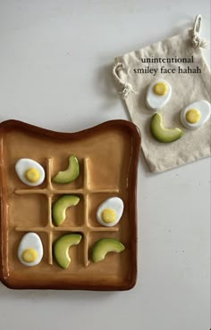 an egg and avocado grid on a plate next to a bag with eggs in it