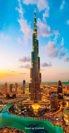 an aerial view of the burj tower in dubai, with its lights on