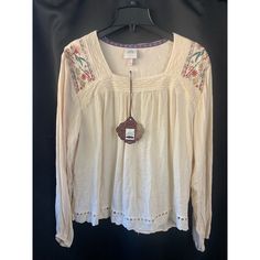 Frilly Peasant Top With Lace And Embroidered Flowers. New With Tags. Women’s Sz L. See Pictures For Approximate Measurements. Cream Bohemian Peasant Top With Floral Embroidery, Casual Fall Peasant Top With Floral Embroidery, Casual Floral Embroidered Peasant Top For Fall, Spring Cream Peasant Top With Floral Embroidery, Beige Embroidered Peasant Top For Spring, Spring Embroidered Cream Peasant Top, Peasant Cream Top With Floral Embroidery, Spring Cream Embroidered Peasant Top, Peasant Style Cream Top With Floral Embroidery