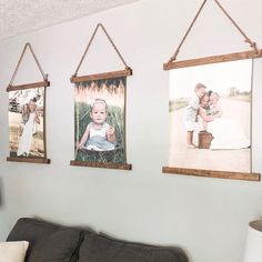 three pictures hanging on the wall in a living room