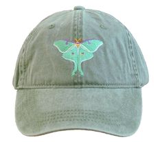 a green hat with a butterfly embroidered on the front and back of it's cap