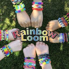 several people standing in a circle with their hands on the word rainbow loom