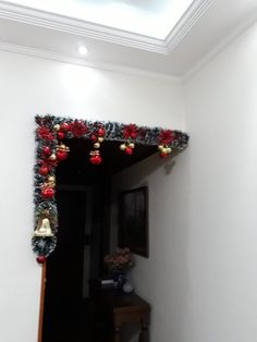 a hallway decorated with christmas decorations and bells