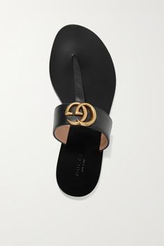 Black Marmont logo-embellished leather sandals | GUCCI | NET-A-PORTER Gucci Black Sandals With Single Toe Strap, Modern Gucci Sandals For Evening, Modern Gucci Evening Sandals, Leather Sandals With Gold-tone Hardware For Evening, Evening Leather Sandals With Gold-tone Hardware, Designer Sandals With Leather Footbed And Single Toe Strap, Black Leather Sandals With Gold-tone Hardware, Chic Sandals With Gold-tone Hardware And Single Toe Strap, Black Sandals With Gold-tone Hardware For Evening