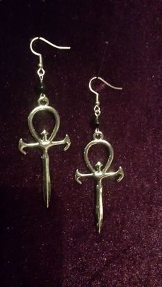 Vampire Ankh Earrings. - Vampire Ankh Symbol (6cmx3cm) - Earhooks in various material : Chose from dropdown box. - Silver colour. - Handmade. - Comes in a pair. Worldwide Shipping More jewellery, accesoires, altar equipment and much more can be found at www.luciferothica.com © Luciferothica.com All Rights Reserved. Vampire Ankh, Vampire Nosferatu, Originals Vampire, Ankh Jewelry, Deathrock Fashion, Ankh Earrings, Vampire Earrings, Ankh Symbol, Goth Earrings