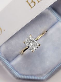 This astonishing stand alone style ring has a 1.52 carat lab grown radiant cut center diamond and is IGI certified at "F" in color and "VVS2" in clarity, (Excellent Cut, Polish and Symmetry) and is set in a classy solitaire plain razor thin setting in 14K yellow gold. The ring can also be made in white/rose gold or platinum and can even be redesigned to your choice. Comes with IGI certification and our lifetime warranty as well. Wedding Ring Gold Band Rectangle Diamond, Engagement Rings Simple Rectangle, Classy Engagement Ring Square, Wedding Rings Gold Square, Gold Band Princess Cut Engagement Ring, Engagement Rings Radiant Cut Gold, Radiant Engagement Ring 1 Carat, Lab Grown Radiant Cut Engagement Ring, Radiant Wedding Ring Set Gold