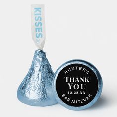 a herss candy bar with a thank you sticker on it and a silver foil wrapped in white paper